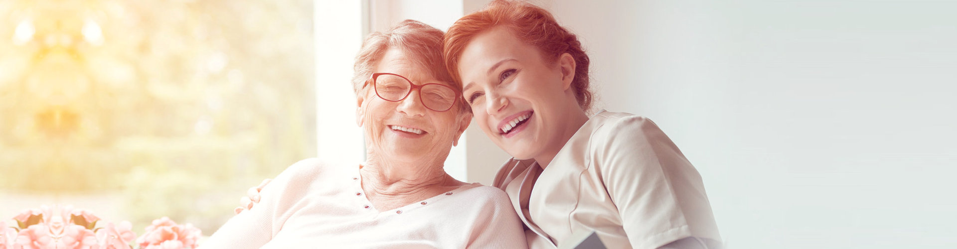 happy caregiver and senior woman