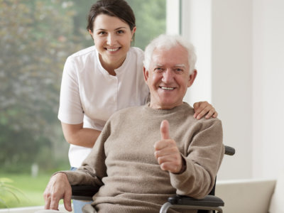 old man and young lady smiling